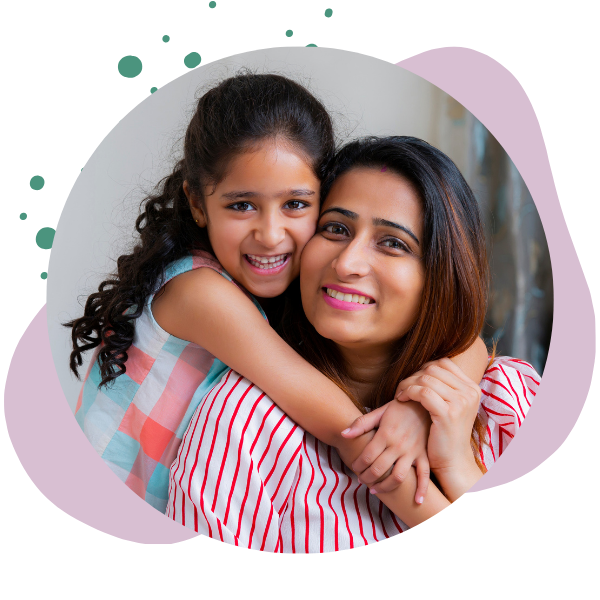 mother and daughter embrace while smiling