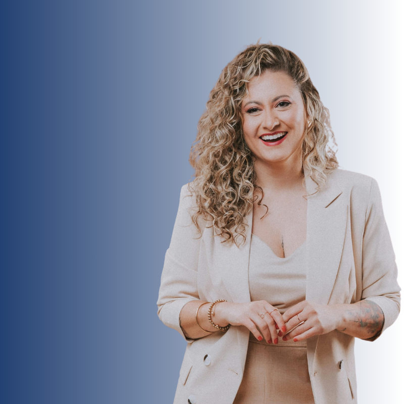 woman in blazer smiling