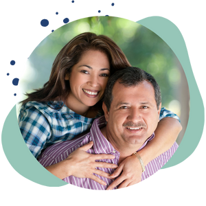 man and woman smile at the camera