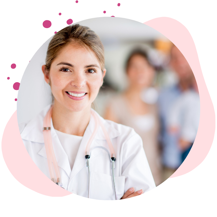 doctor smiles in foreground with family in background